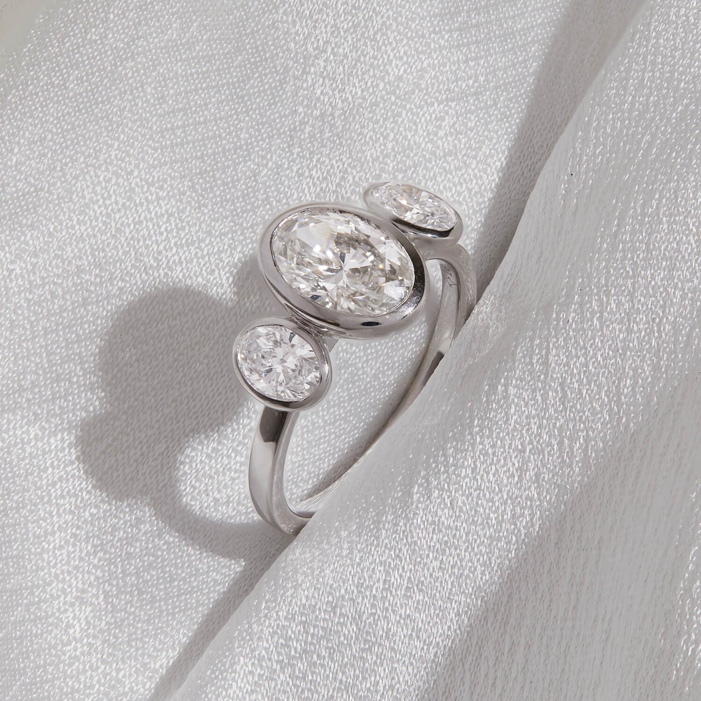 Born Platinum Lab Grown 2.80ct Oval Diamond Three Stone Bezel Set Ring